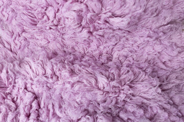 background texture. llama fur. purpur faux fur. fabric for clothes