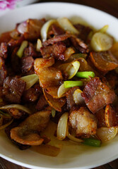 Delicious Glazed Pork belly cooked with fish sauce and onions