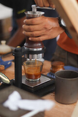 Fototapeta na wymiar Barista push manual espresso maker for coffee