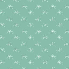 Background of simple snowflakes on a pale green background