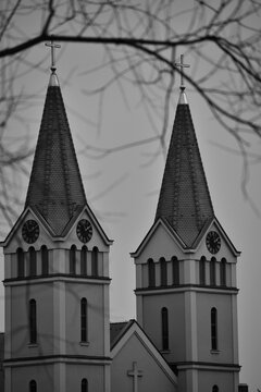 Vertical black and white shot of the St. Anthony of Padua church in Zepce, Bosnia and Herzegovina