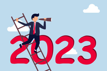 Year 2023 business outlook, vision to see the way  businessman leader using telescope to see vision on top of ladder above year 2023 number.