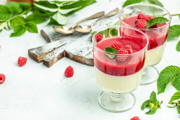 Berry dessert with cream sauce in small jars. Italian dessert. Raspberry Panna cotta with raspberry...