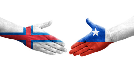 Handshake between Chile and Faroe Islands flags painted on hands, isolated transparent image.