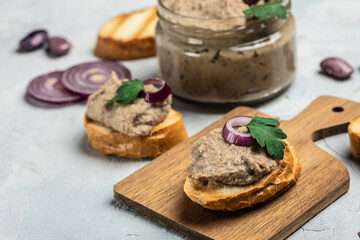 Homemade mushroom and bean paste. Mexican cuisine pate of beans, Pate in glass jar. Tasty sandwich. healthy vegetarian food, banner, menu, recipe place for text, top view
