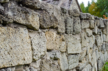 Old masonry of travertine at an angle to the observer