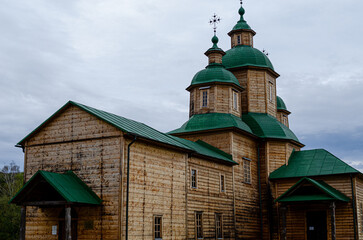 Fototapeta na wymiar Ancient wooden church in Ukraine Cross