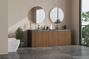 Modern bathroom interior with beige walls, marble basin with double mirror and grey concrete floor.Minimalist bathroom with modern furniture. Overlooks tree and landscape view.3D Rendering