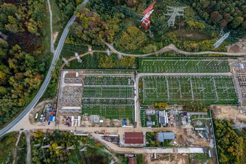 Aerial view of electric energy distribution plant, at sunrise, from above. Aerial photo captured with a drone