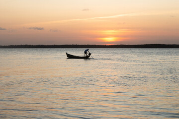beautiful sunset with a boat on the river