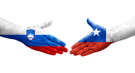 Handshake between Chile and Slovenia flags painted on hands, isolated transparent image.