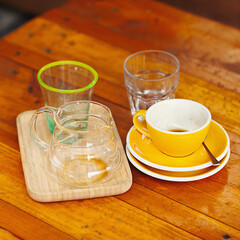 cups after drinking coffee on a wooden table. Concept for ending a meeting or something else.