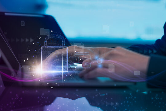 Man using laptop computer,shield,padlock icon,concept internet network security,preventing website attacks keeping financial information,data network security,with internet of things(iot)technology - Powered by Adobe