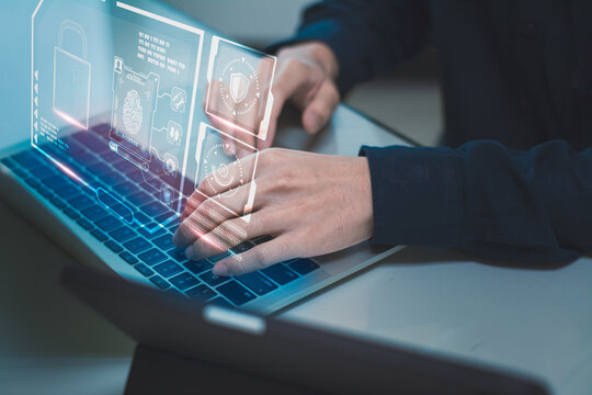 Man using laptop computer,shield,padlock icon,concept internet network security,preventing website attacks keeping financial information,data network security,with internet of things(iot)technology