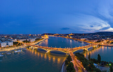 Obraz premium Budapest by night. Hungary - skyline panorama of Budapest in the night. The Danube the Parliament the Chain Bridge and the Buda Castle and the Margaret Bridge in front. Blue hour photo.
