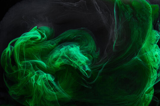 Black green smoke abstract background, acrylic paint underwater explosion, swirling ink