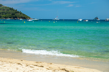 Crystal clear blue water of legendary Pampelonne beach near Saint-Tropez, summer vacation on white sandy beaches of French Riviera, France