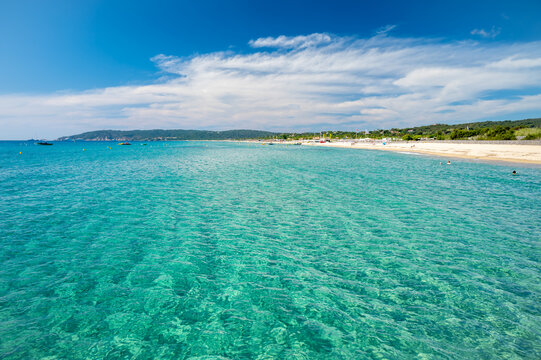 Crystal clear blue water of legendary Pampelonne beach near Saint-Tropez, summer vacation on white sandy beaches of French Riviera, France