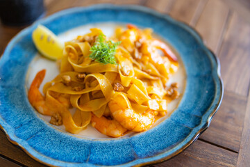 Fettuccine pasta with shrimp tomatoes and herbs