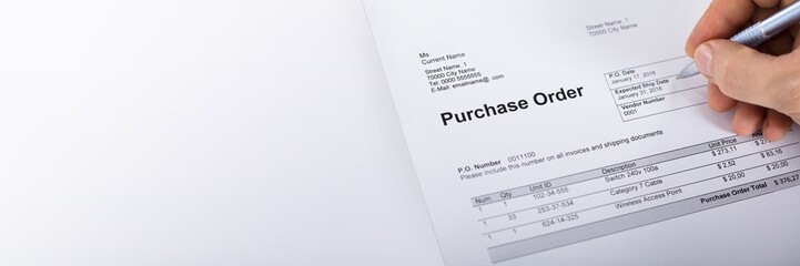 Person Filling A Purchase Order Form