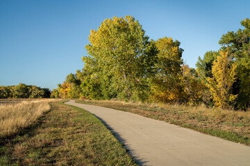 paved bike trail along the Poudre River in Fort Collins area in northern Colorado, fall scenery, recreation and commuting concept © MarekPhotoDesign.com
