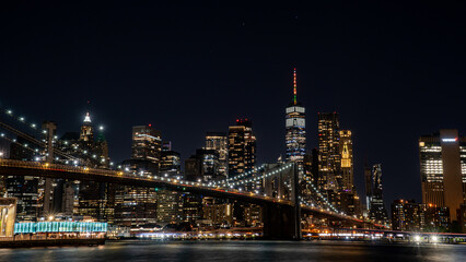 Fototapeta na wymiar night time NYC Skyline + Bridge