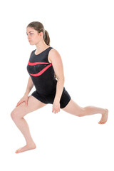Fototapeta premium Young woman warming up for a gymnastics exercise.