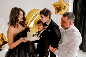 Birthday cake. boys blowing candle
