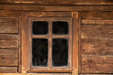 Fototapeta na wymiar Wooden old house with windows in Ukraine, the window