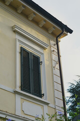 A window with a green shutter 