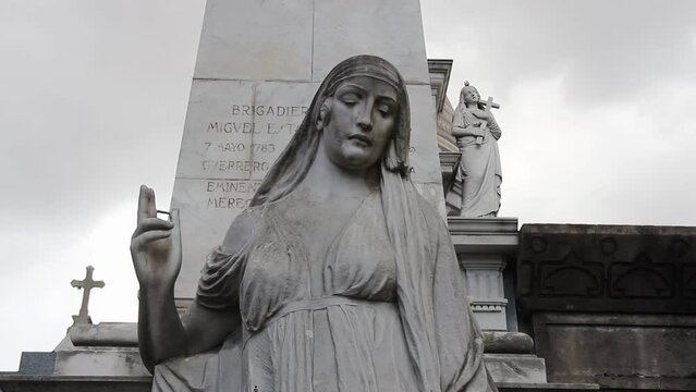 Statue of Woman in Recoleta Cemetery, Buenos Aires, Argentina. 4K Resolution.