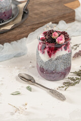 Chia pudding with blackberries and jam in glass jars. Concept of healthy eating, healthy lifestyle, dieting, fitness menu