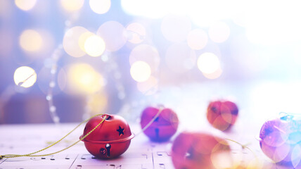 Christmas carol with jingle bells and candles