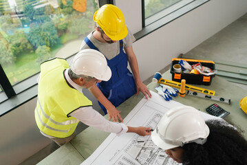 Architect and construction engineer or surveyor discussion plans and blueprints