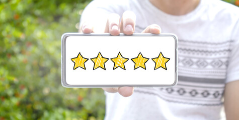 Five star cartoon sketch style on screen smartphone with blurred background. Service rating,...