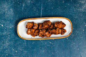 spicy bbq chicken tikka boti kabab served in a dish isolated on background top view