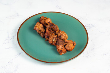 spicy bbq chicken tikka boti kabab served in a dish isolated on background top view