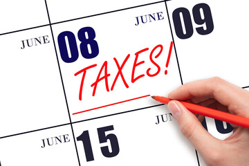 Hand drawing red line and writing the text Taxes on calendar date June 8. Remind date of tax payment