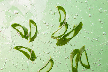 Group of slices of aloe vera in the cosmetics gel with bubbles inside.Cosmetics background.
