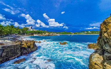 Obraz premium Beautiful surfer waves rocks cliffs at beach Puerto Escondido Mexico.