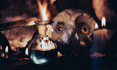 Magic potion, fire, candles and an owl