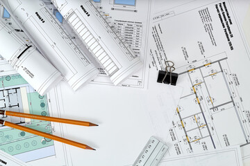 Working tools and drawings of the designer on a white background. Construction of houses, drawing,...