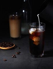 Cold coffee with ice in low key