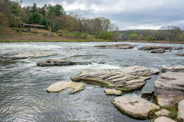 Cascades of Upper Delaware River at Skinners Falls Rocky Beach in Narrowsburg, NY.