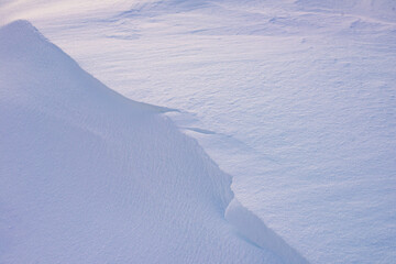 Background of fresh snow, blue shadows