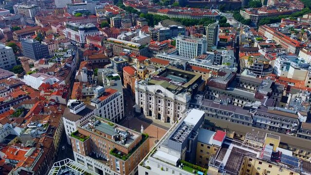 Aerial view of the Borsa Piazza Affari. Krishi houses in the city. Attractions for tourists. A crisis. Statue of the middle finger on the hand. Finance. Architecture. Italy, Milan