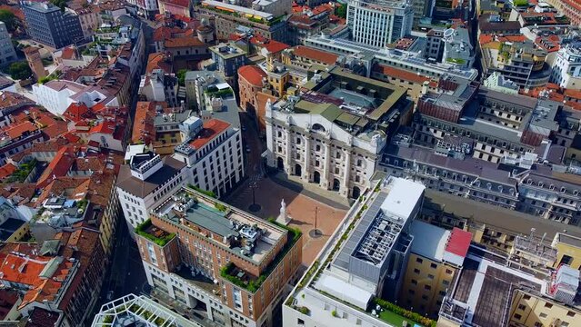 Aerial view of the Borsa Piazza Affari. Krishi houses in the city. Attractions for tourists. A crisis. Statue of the middle finger on the hand. Finance. Architecture. Italy, Milan