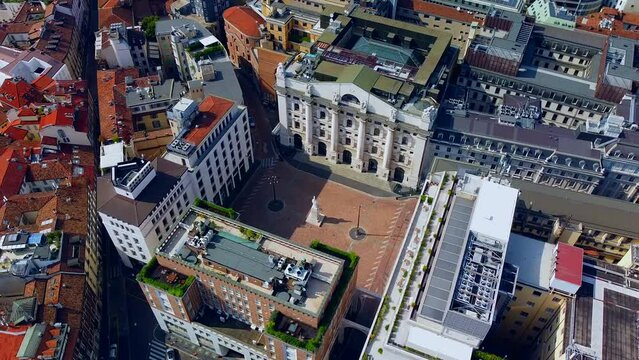 Aerial view of the Borsa Piazza Affari. Krishi houses in the city. Attractions for tourists. A crisis. Statue of the middle finger on the hand. Finance. Architecture. Italy, Milan