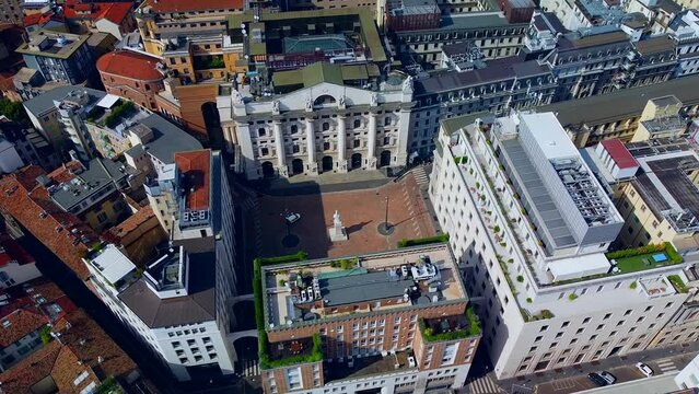 Aerial view of the Borsa Piazza Affari. Krishi houses in the city. Attractions for tourists. A crisis. Statue of the middle finger on the hand. Finance. Architecture. Italy, Milan