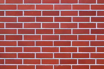 The texture of the red brick wall.